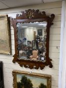 A fret cut mahogany wall mirror, width 78cm, height 105cm