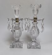 A pair of early 19th century cut glass table lustres, on faceted square bases, 26cm