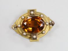 A Victorian yellow metal and large oval cut citrine set brooch, with split pearl set border, 51mm,