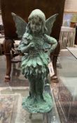 A patinated cast metal angel garden ornament, height 55cm