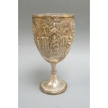 A 19th century Indian embossed white metal presentation goblet, with engraved inscription, 22.7cm,