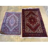 Two Senneh red ground mats, larger 130 x 80cm