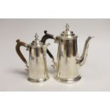Two George V silver cafe au lait pots, the smaller by Chares & Richard Comyns, London, 1926, gross