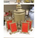 A brass tea urn and two pairs of brass photo frames, tallest 50cm