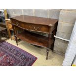 An Edwardian mahogany serpentine two tier serving table, width 122cm, depth 57cm, height 94cm