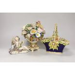 A Rockingham style floral encrusted basket, a Dresden floral centrepiece and a Meissen putti and