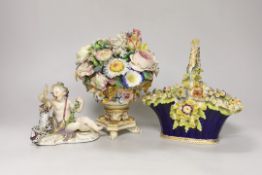 A Rockingham style floral encrusted basket, a Dresden floral centrepiece and a Meissen putti and