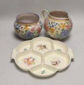 A Poole pottery tulip floral vase and jug and an hors d'oeuvre dish