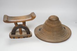 An Ashanti wood headrest and a small African wood shield