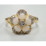 A modern 18k yellow metal, white opal and diamond chip set flower head cluster ring, size P, gross