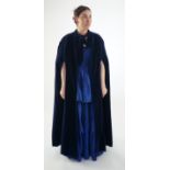 A lady's midnight blue long evening cape. Maindel label