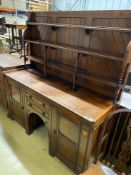 A Victorian aesthetic movement mahogany dresser with Latin motto to the frieze, width 168cm, depth