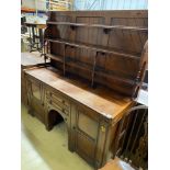 A Victorian aesthetic movement mahogany dresser with Latin motto to the frieze, width 168cm, depth