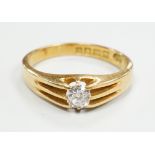 A George V 18ct gold and claw set solitaire diamond ring, size R, gross weight 5.1 grams.