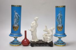 A pair of French enamelled glass vases, two Chinese blanc de chine figures on a stand and a