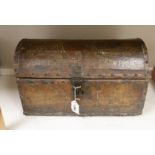 A small leather covered domed trunk, 45cm wide, 26cm high