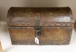 A small leather covered domed trunk, 45cm wide, 26cm high