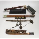 A collection of four Chinese or Indonesian opium pipes, 41.5cm long