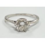 A white metal (stamped plat) and solitaire diamond set ring, size M, gross weight 3.1 grams, the