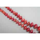 A modern single strand graduated polished ruby pebble necklace, with 585 yellow metal clasp, 54cm.