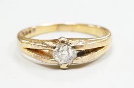 An 18ct gold and claw set solitaire diamond ring, size O, gross weight 3.9 grams.
