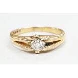 An 18ct gold and claw set solitaire diamond ring, size O, gross weight 3.9 grams.