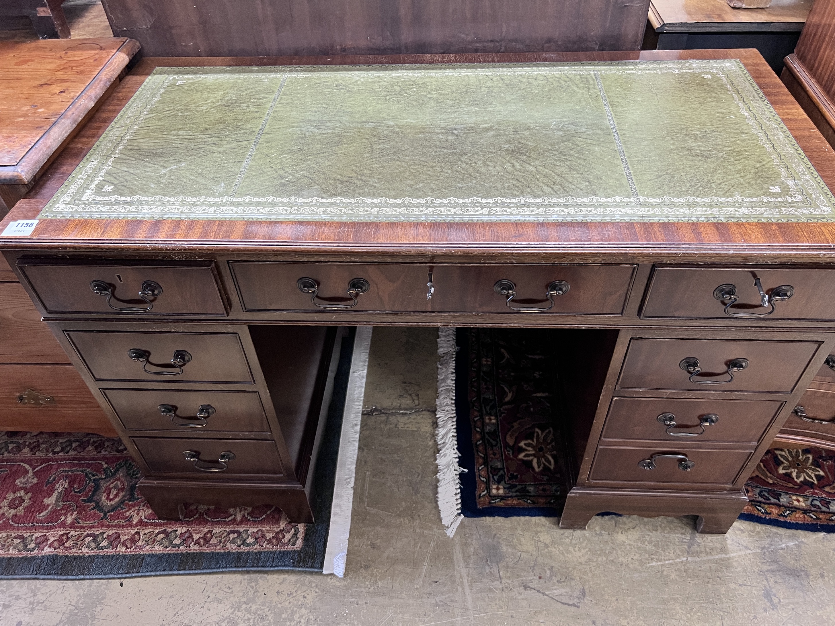 A reproduction mahogany pedestal desk, width 122cm