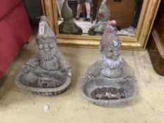 A pair of cast stone gnome bird baths, height 40cm