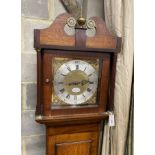An early 19th century mahogany and banded oak eight day longcase clock marked Thomas Quested, Wye,