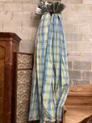 A pair of blue / green check lined curtains approximate widths 140cm top, 320cm floor, drop 250cm