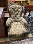 A Victorian mahogany spoonback armchair, width 70cm, depth 60cm, height 102cm