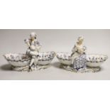 A pair of late 19th century Meissen figural sweetmeat dishes, 24.5cm wide