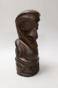 A Maori type carved hardwood totem figure, 26cm high