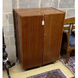 A mid century Newcraft Ltd. teak 'magic box' home office, width 84cm, depth 53cm, height 117cm