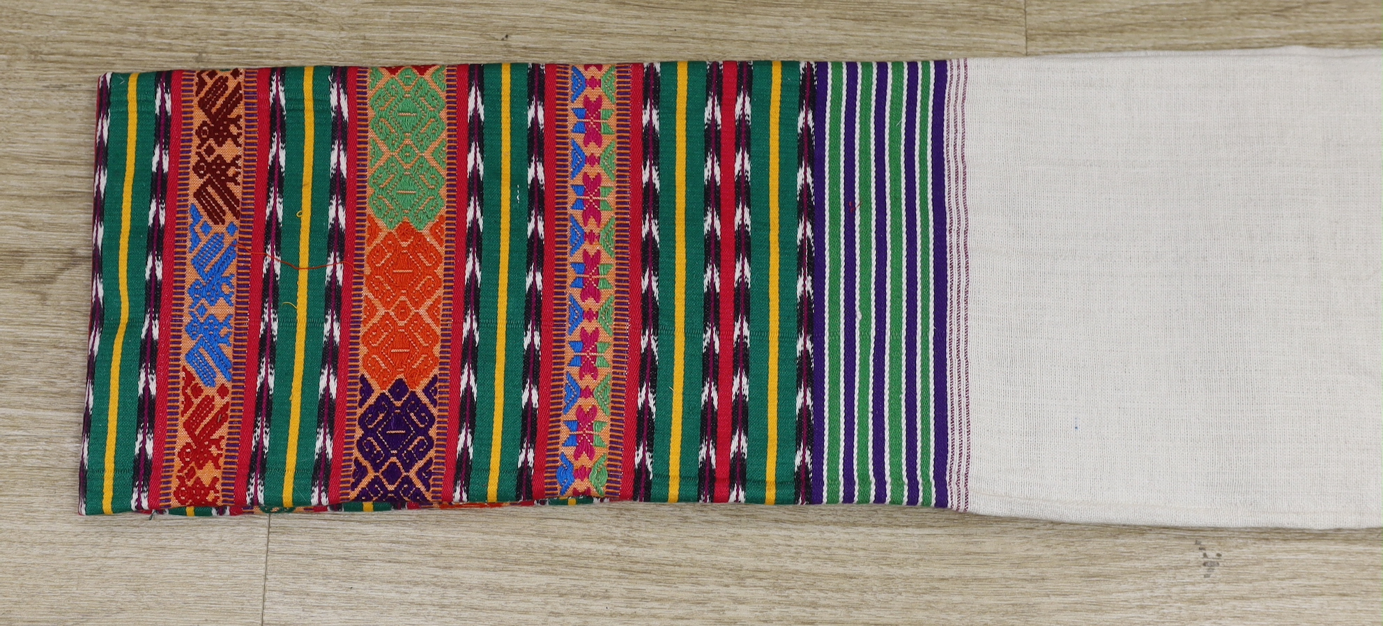 A Guatemalan shawl, the lower part polychrome woven with chevrons, stylised flowers and geometric - Image 2 of 2