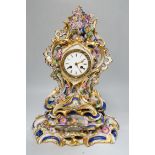 A mid 19th century French porcelain mantel clock and stand, probably Jacob Petit, 43cm tall