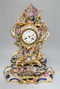 A mid 19th century French porcelain mantel clock and stand, probably Jacob Petit, 43cm tall