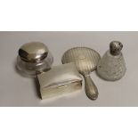 A George V silver backed hand mirror, a silver mounted cigarette box, a silver topped powder bowl