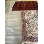 A machined Bokhara style rug, 140 x 72cm together with a North West Persian style rug and a