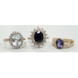 Three assorted modern 9ct gold and gem set dress rings, including sapphire and diamond chip set oval