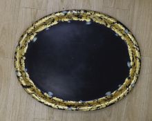 A large Regency oval japanned papier mache tray, 81cm long
