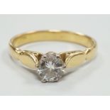 An 18ct and solitaire diamond set ring, size O, gross weight 3.6 grams.