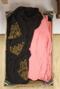 A 1940's ladies beaded and embroidered black crepe evening dress and a pink crepe day dress and a