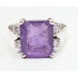 A modern 585 white metal single stone amethyst and four stone diamond set dress ring, size S/T,