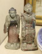 An Indonesian hand painted calendar and two similar figures, tallest 21cm