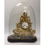 A 19th century gilt-spelter figural mantel clock, on stand under a glass dome, total height 47cm