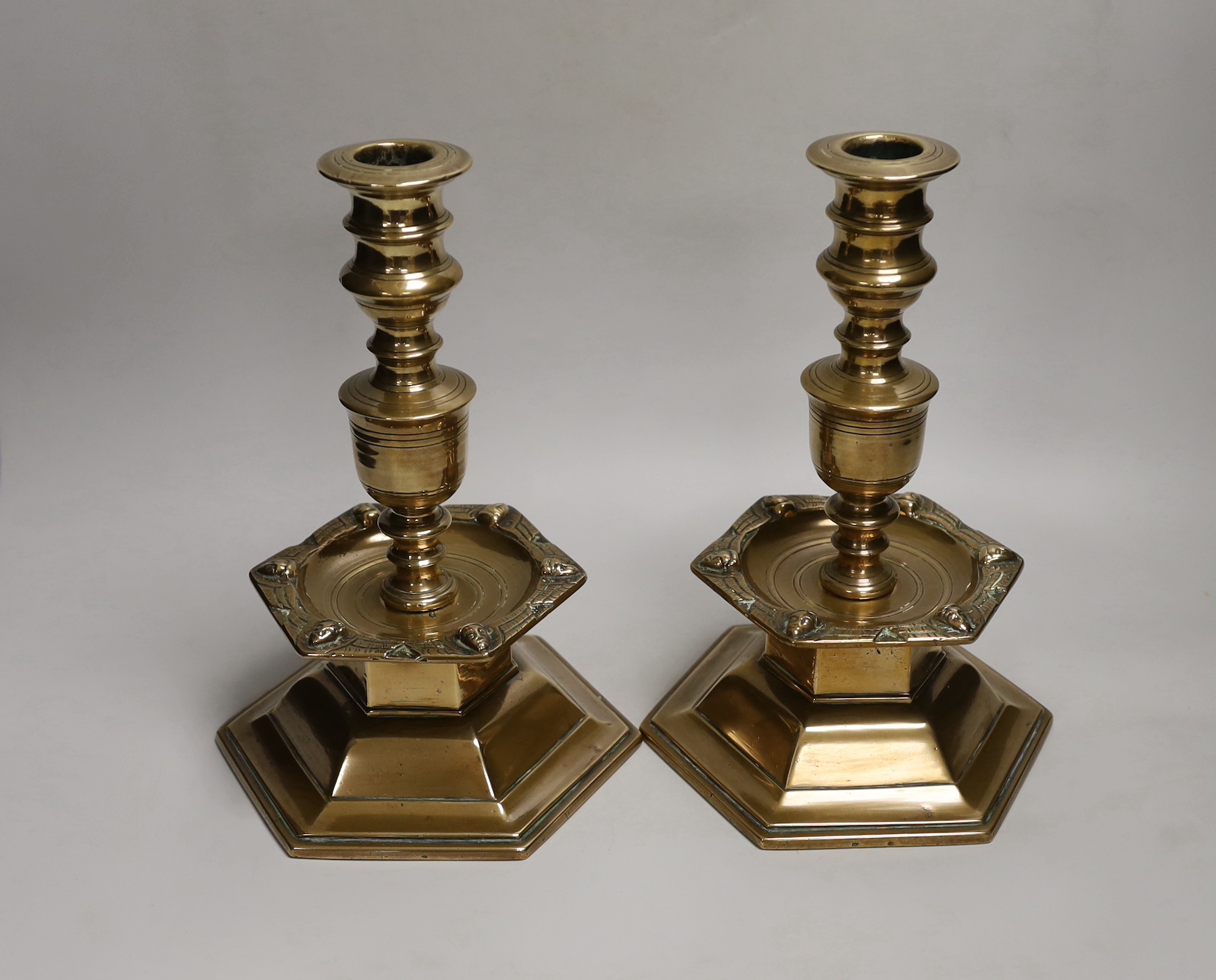 A pair of Scandinavian, possibly 17th century, brass candlesticks, dated 1644, each with a shield - Image 2 of 2