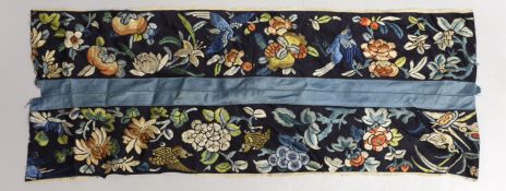 A Chinese embroidered silk sleeve panel