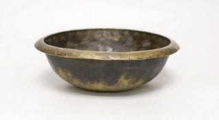 A Tibetan brass singing bowl, Lishui pattern, 23cm diameter