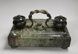 A 19th century green marble inkstand, with brass snake handle, 33cm wide, 23cm deep